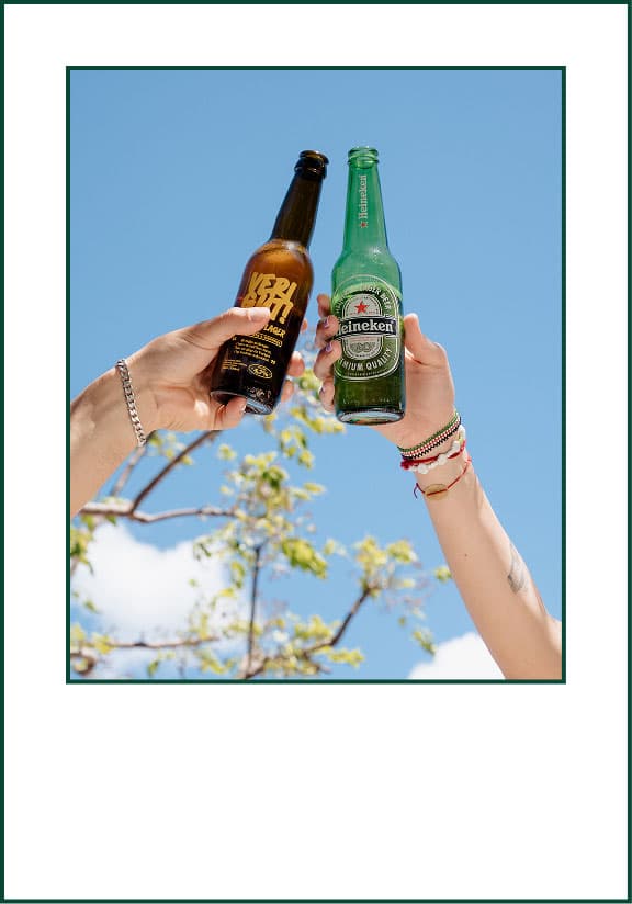 People raising drinks outside